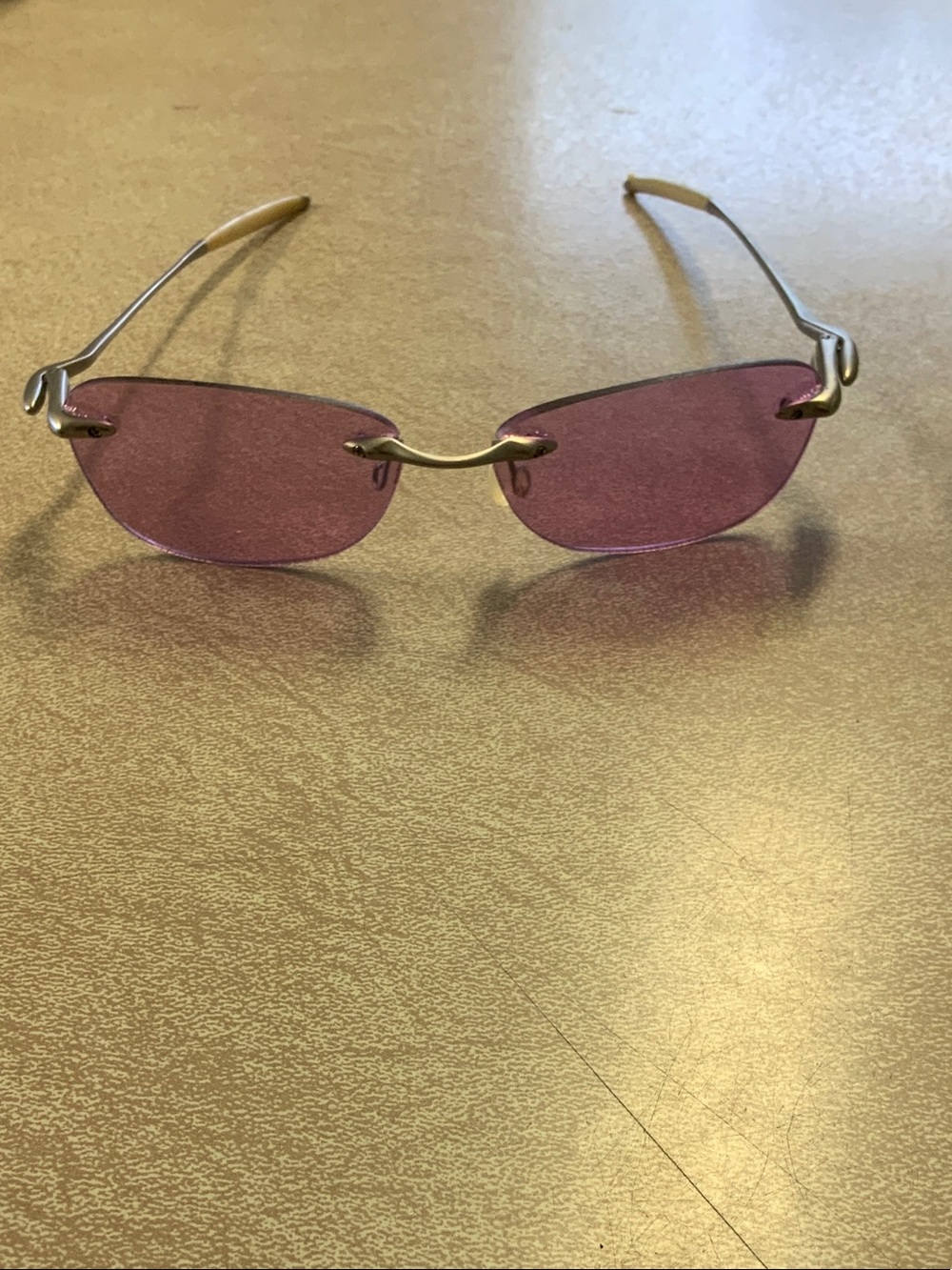 Rimless Women's Sunglasses with Pink Lenses and Gold Accents